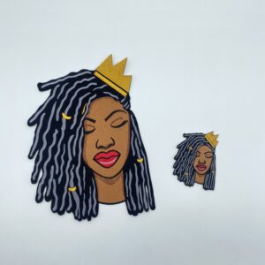 Black woman with dreadlocks and crown.