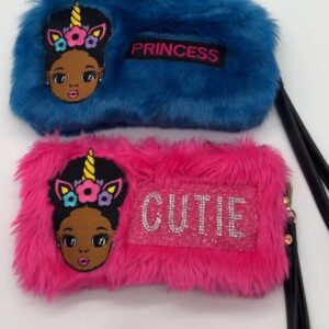 A pair of furry purses with princess and cutie on them.