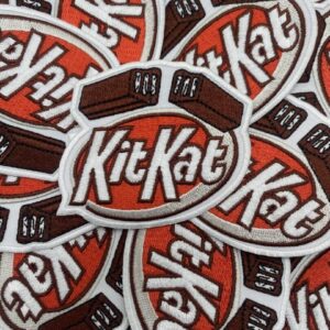 Multiple KitKat logo stickers with a red, white, and black color scheme.
