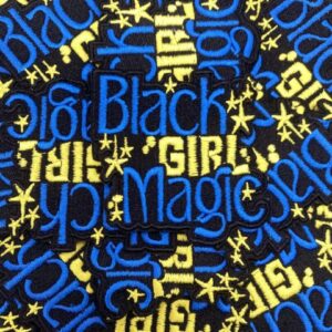 Pattern with 'Black Girl Magic' text in blue and gold on black background.